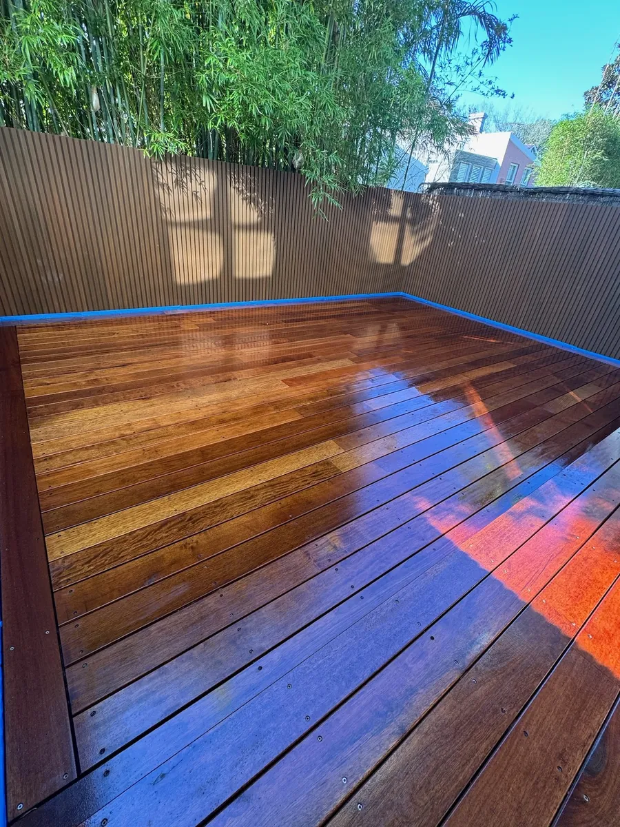 Deck with composite slat fence